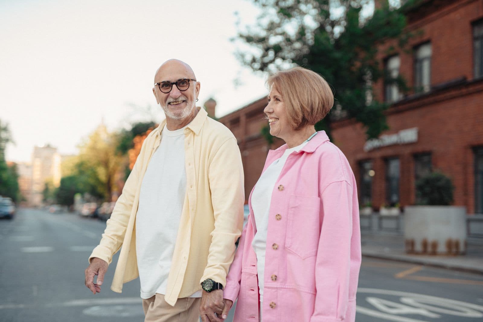 Happy senior couple walking outdoors, enjoying an active day